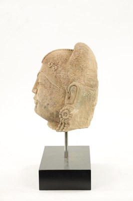 Lot 52 - A CARVED STONE HEAD OF AN INDIAN BUDDHA