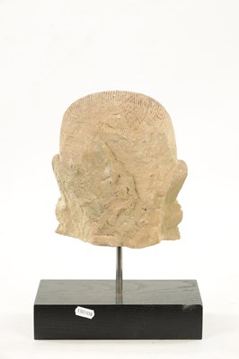 Lot 52 - A CARVED STONE HEAD OF AN INDIAN BUDDHA