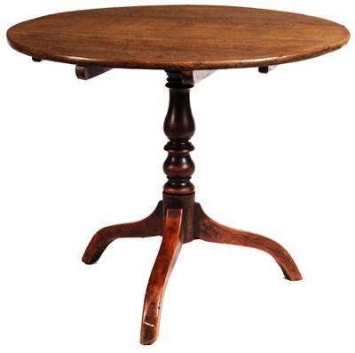 Lot 662 - An early George III Oak tilt-top SUPPER TABLE...