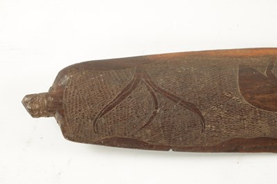 Lot 298 - AN ABORIGINAL MULGA WOOD SPEAR THROWER  WITH CARVED ANIMALS AND AN OLD BOOMERANG.