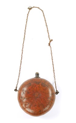 Lot 228 - A 19TH CENTURY ENGRAVED GOURD POWDER FLASK