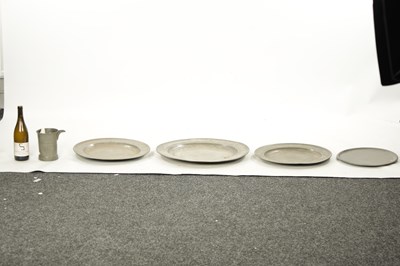 Lot 273 - A SET OF FOUR 18TH CENTURY PEWTER PLATES AND A LIPPED TANKARD