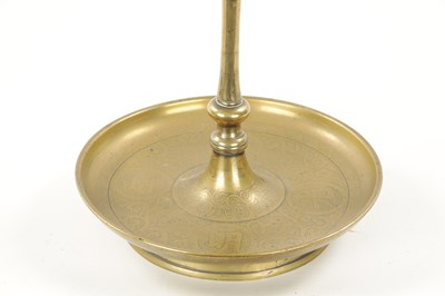 Lot 167 - A 19TH CENTURY EASTERN BRASS CANDLESTICK