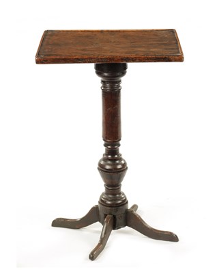 Lot 326 - AN 18TH CENTURY PRIMITIVE OAK FOUR-LEGGED CANDLE TABLE