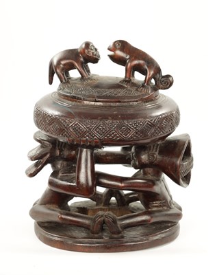 Lot 309 - A CARVED HARDWOOD LUBA DUAL DIVINATION LIDDED CUP