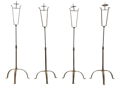 Lot 241 - A SET OF FOUR IRONWORK CHURCH FLOOR STANDING CANDLESTICKS