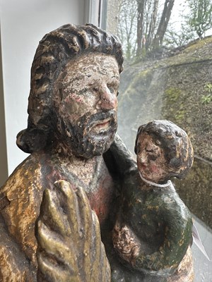 Lot 100 - AN EARLY 18TH CENTURY SPANISH CARVED FIGURE OF MOSES WITH CHILD