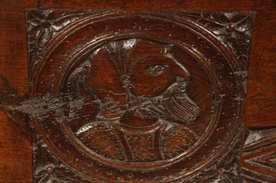 Lot 316 - AN IMPORTANT 17TH CENTURY CARVED OAK PLANK COFFER WITH CARVED ROMANESQUE HEADS