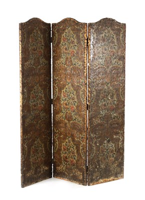 Lot 240 - A 19TH CENTURY EMBOSSED LEATHER FOLDING SCREEN