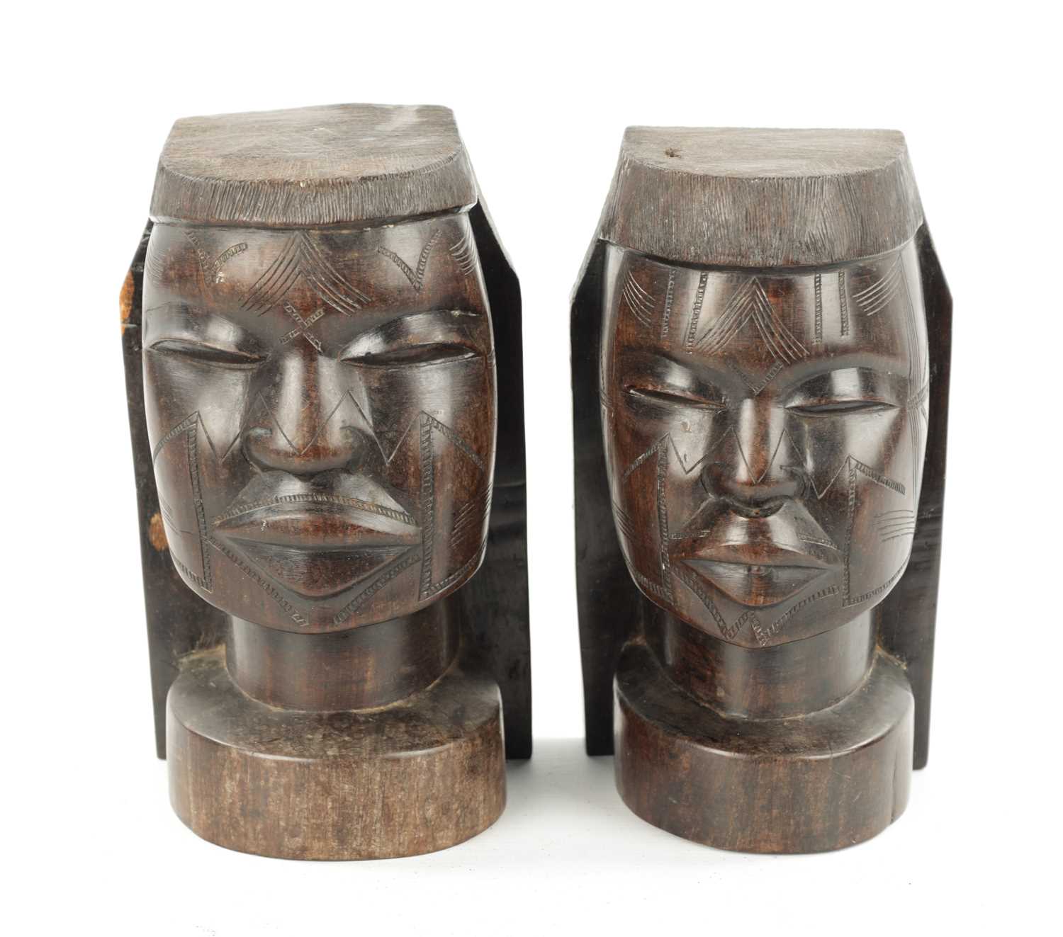 Lot 82 - A PAIR OF CARVED HARDWOOD NATIVE BOOKENDS