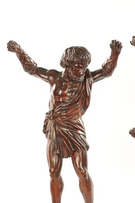 Lot 337 - A PAIR OF GRAND TOUR CARVED WALNUT GLADIATORS AFTER THE BORGHESE BRONZE ROMAN FIGURES