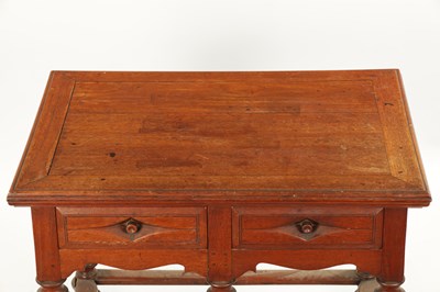Lot 353 - AN UNUSUAL 18TH CENTURY COLONIAL PADOUK WOOD TWO DRAWER TABLE ON BALLUSTER LEGS WITH SHAPED STRETCHERS