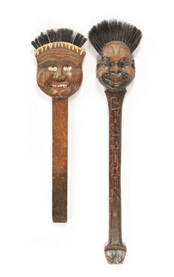 Lot 180 - TWO UNUSUAL EARLY 20TH CENTURY CARVED WOOD LONG-HANDLED COMICAL BRUSHES