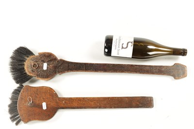 Lot 180 - TWO UNUSUAL EARLY 20TH CENTURY CARVED WOOD LONG-HANDLED COMICAL BRUSHES