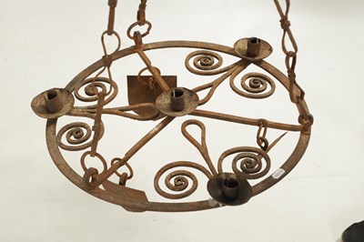 Lot 144 - AN ARTS AND CRAFTS MEDIEVAL STYLE WROUGHT IRON HANGING CHANDELIER
