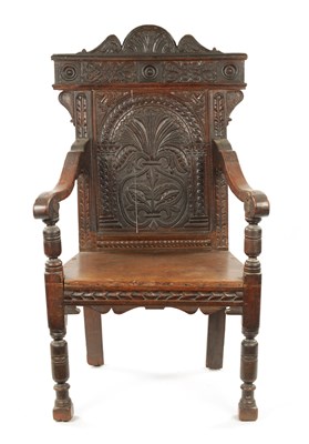 Lot 55 - A 17TH CENTURY CARVED OAK WAINSCOT CHAIR