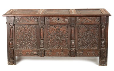 Lot 261 - A 17TH CENTURY CARVED OAK THREE PANELLED FRONT COFFER