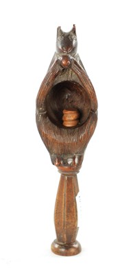 Lot 383 - A 19TH CNEUTRY CARVED FRUITWOOD TREEN NUTCRACKER