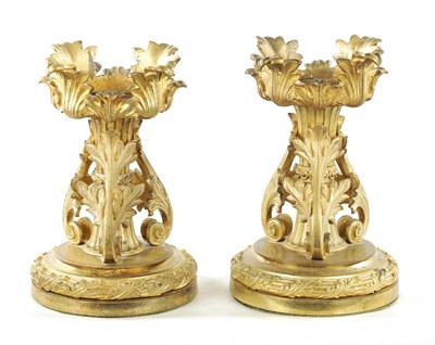 Lot 788 - A PAIR OF EARLY 19TH CENTURY GILT ORMOLU FIRE DOGS