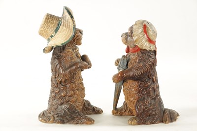 Lot 948 - A PAIR OF LATE 19TH CENTURY AUSTRIAN COLD-PAINTED TERRACOTTA MODELS OF DOGS