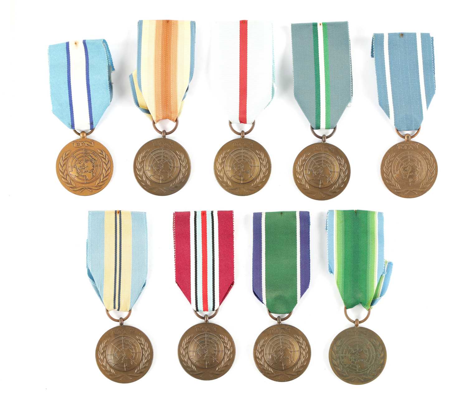 Lot 846 - A COLLECTION OF NINE UN SERVICE OF PEACE MEDALS