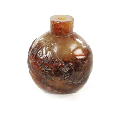 Lot 551 - A CHINESE CARVED RUSSET JADE SNUFF BOTTLE
