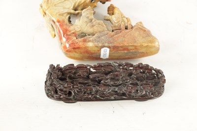 Lot 511 - A CHINESE QING DYNASTY SOAPSTONE FIGURAL GROUP CARVING