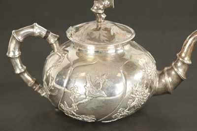 Lot 543 - A LATE 19TH CENTURY CHINESE SILVER THREE-PIECE TEA SET