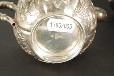 Lot 543 - A LATE 19TH CENTURY CHINESE SILVER THREE-PIECE TEA SET