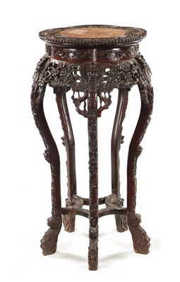 Lot 613 - A 19TH CENTURY CHINESE CARVED HARDWOOD JARDINIERE STAND