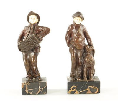 Lot 997 - A PAIR OF ARTS AND CRAFTS BRONZE AND IVORY FIGURES