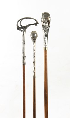 Lot 777 - A COLLECTION OF THREE ART NOUVEAU SILVER TOPPED WALKING STICKS