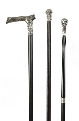 Lot 743 - A COLLECTION OF THREE 19TH CENTURY SILVER TOPPED WALKING STICKS