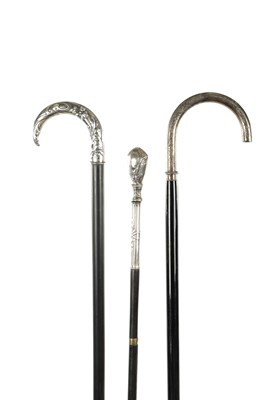 Lot 751 - A COLLECTION OF THREE ART NOUVEAU SILVER TOPPED WALKING STICKS