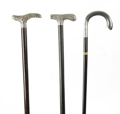 Lot 760 - A COLLECTION OF THREE 19TH CENTURY SILVER TOPPED WALKING STICKS