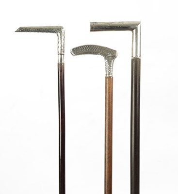 Lot 774 - A COLLECTION OF THREE LATE 19TH CENTURY SILVER TOPPED WALKING STICKS