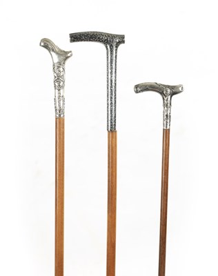 Lot 770 - A COLLECTION OF THREE SMALL 19TH CENTURY SILVER TOPPED WALKING STICKS