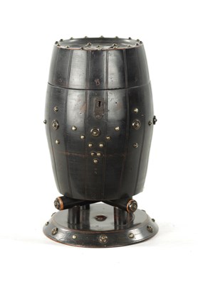 Lot 1047 - A 19TH CENTURY EBONISED CARVED WOOD TEA CADDY IN THE FORM OF A BARREL