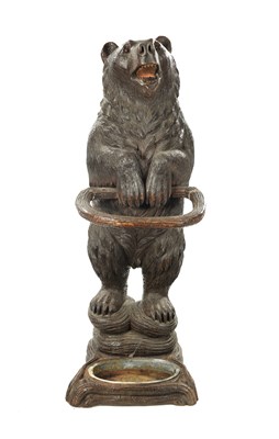 Lot 1040 - A LATE 19TH CENTURY CARVED BLACK FOREST BEAR STICK STAND