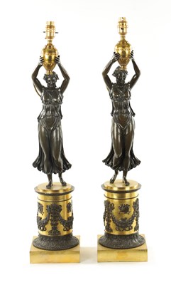 Lot 973 - A PAIR OF REGENCY GILT AND BRONZE FIGURAL LAMP BASES