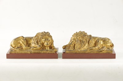 Lot 698 - A PAIR OF LATE 19TH CENTURY GILT BRONZE RECUMBENT LIONS
