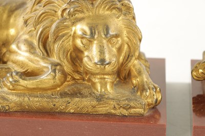 Lot 698 - A PAIR OF LATE 19TH CENTURY GILT BRONZE RECUMBENT LIONS