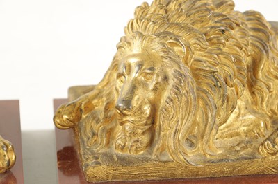 Lot 698 - A PAIR OF LATE 19TH CENTURY GILT BRONZE RECUMBENT LIONS