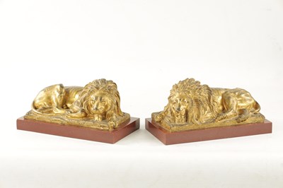 Lot 698 - A PAIR OF LATE 19TH CENTURY GILT BRONZE RECUMBENT LIONS
