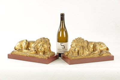 Lot 698 - A PAIR OF LATE 19TH CENTURY GILT BRONZE RECUMBENT LIONS