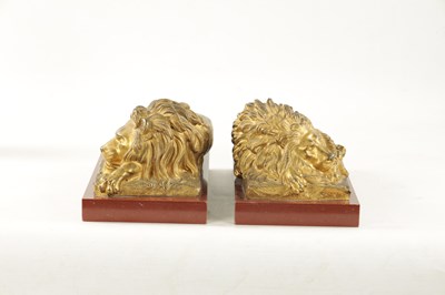 Lot 698 - A PAIR OF LATE 19TH CENTURY GILT BRONZE RECUMBENT LIONS