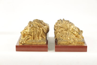 Lot 698 - A PAIR OF LATE 19TH CENTURY GILT BRONZE RECUMBENT LIONS