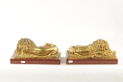 Lot 698 - A PAIR OF LATE 19TH CENTURY GILT BRONZE RECUMBENT LIONS