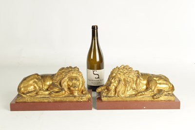 Lot 698 - A PAIR OF LATE 19TH CENTURY GILT BRONZE RECUMBENT LIONS