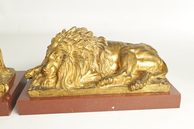 Lot 698 - A PAIR OF LATE 19TH CENTURY GILT BRONZE RECUMBENT LIONS